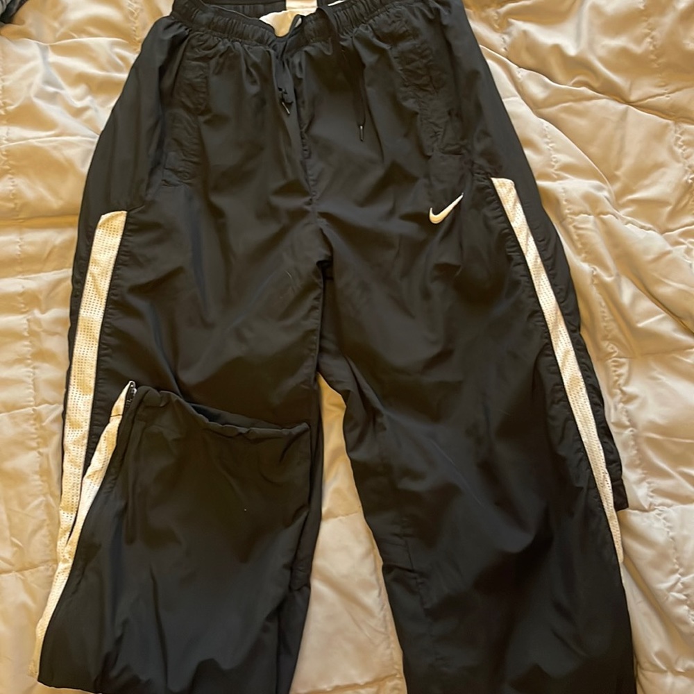 Small black Nike sweatpants.